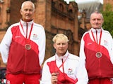 David Fisher, Paul Brown and Bob Love of England pose with their bronze medals won in the Para-Sport Open Triples B6/B7/B8 lawn bowls at Kelvingrove Lawn Bowls Centre during day eight of the Glasgow 2014 Commonwealth Games on July 31, 2014