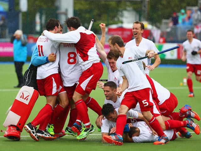 England players celebrate as they win bronze after a shoot out in the bronze medal match between New Zealand and England at Glasgow National Hockey Centre during day eleven of the Glasgow 2014 Commonwealth Games on August 3, 2014