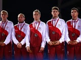 Andrew Baggaley, Paul Drinkhall, Liam Pitchford, Danny Reed, and Sam Walker of Team England pose with their Silver Medals after winning the Silver Medal in the Men's Team Table Tennis Final between Singapore and England at Scotstoun Sports Campus during d