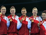 The England women's gymnastics team pose with their medals after winning gold in the team gymnastics at the SECC Precinct during the 2014 Commonwealth Games in Glasgow on July 29, 2014