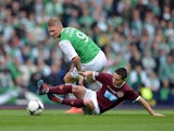 Garry O'Connor of Hibernian tackles Ian Black of Hearts during the William Hill Scottish Cup final between Hibernian and Hearts at Hampden Park on May 19, 2012