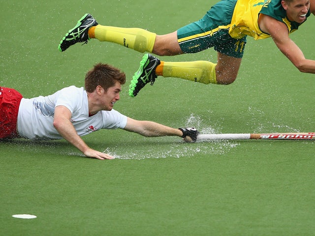 Henry Weir of England reaches for the ball in the Men's Semi-Final match between Australia and England at Glasgow National Hockey Centre during day ten of the Glasgow 2014 Commonwealth Games on August 2, 2014