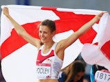 Isobel Pooley celebrates with the England flag after winning silver in the women's high jump on August 1, 2014