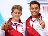 England's James Denny and Tom Daley pose with their silver medals after finishing second in men's synchronised 10m platform final at the Commonwealth Games on August 1, 2014
