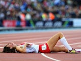 Jessica Judd lies on the track after completing the women's 800m final on August 1, 2014
