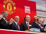 Manchester United Executives Joel Glazer and Avram Glazer and Ed Woodward prepare to ring the Opening Bell at the New York Stock Exchange on August 10, 2012
