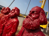 Red Karl Marx sculptures of artist Ottmar Hoerl are pictured at a company in Trier, Germany on April 4 , 2013