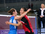  Gold medalist Michelle Li of Canada is congratulated by Kirsty Gilmour of Scotland following the Women's Singles Gold Medal Match at Emirates Arena during day eleven of the Glasgow 2014 Commonwealth Games on August 3, 2014