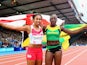 Silver medalist Laura Samuel of England and gold medalist Kimberly Williams of Jamaica celebrate after the Women's Triple Jump final on July 29, 2014