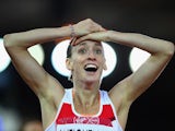 England's Laura Weightman celebrates winning silver in the women's 1500m on July 29, 2014