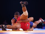 Leon Rattigan of England competes with Umair Tariq of Pakistan in the Men's 61kg wrestling at Scottish Exhibition And Conference Centre during day seven of the Glasgow 2014 Commonwealth Games on July 30, 2014