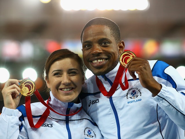 Gold medalist Libby Clegg of Scotland and her guide Mikail Huggins on the podium during the medal ceremony for the Women's 100m T12 Finalat Hampden Park during day five of the Glasgow 2014 Commonwealth Games on July 28, 2014