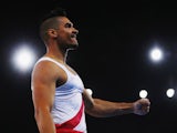 Louis Smith of England celebrates after completing his pommel horse routine for the Commonwealth Games men's artistic gymnastics team final at Glasgow's SSE Hydro on July 28, 2014