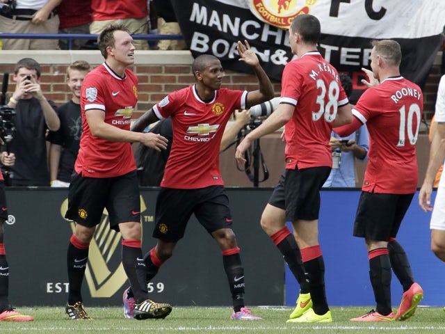 Ashley Young #18 of Manchester United celebrates his first half goal against Real Madrid with Michael Keane #38, Wayne Rooney #10 and Phil Jones #4, left, during the Guinness International Champions Cup at Michigan Stadium on August 2, 2014