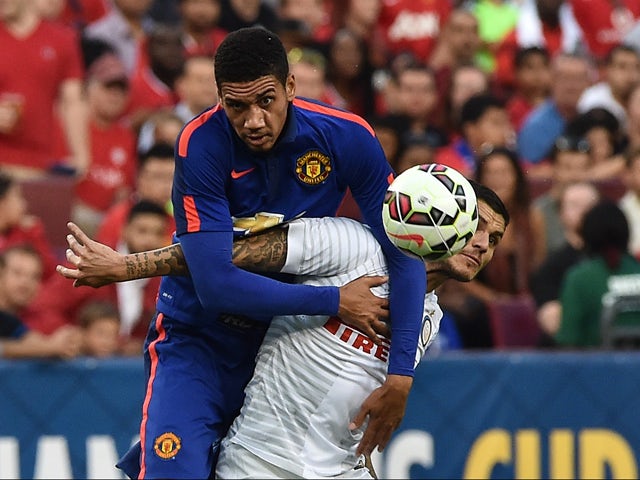 Manchester United's Chris Smalling vies with Inter Milan's Mauro Icardi during a Champions Cup match at FedEx Field in Landover, Maryland, on July 29, 2014