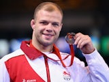 Mike Grundy of England with his Bronze medal after the 74kg Freestyle Wrestling Bronze medal match on July 29, 2014