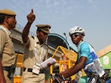 Cyclists Sesay Moses Lansana talks to security at the Athletes Village ahead of the Delhi 2010 Commonwealth Games on October 1, 2010 
