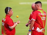 Paul Taylor and Jonathan Tomlinson and Marc Wyatt of Wales compete against Scotland in the Men's Triples round 5 match against Australia at Kelvingrove Lawn Bowls Centre during day three of the Glasgow 2014 Commonwealth Games on July 26, 2014