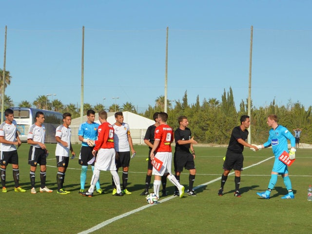 Pre-match handshakes between Valencia and Pontypridd Town on June 26, 2014