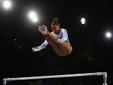 England's Rebecca Downie competes on the uneven bars during day one of the women's artistic gymnastics team final at Glasgow's SSE Hydro on July 28, 2014