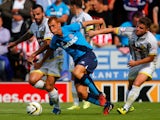 Robbie Weir and Alex MacDonald of Burton in action with Steve Sidwell of Stoke during the pre season friendly match between Burton Albion and Stoke City at the Pirelli Stadium on August 2, 2014