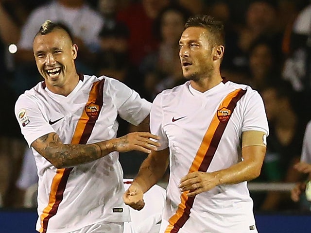 Francesco Totti #10 of AS Roma celebrates a goal with Radja Nainggolan #4 against Real Madrid during a Guinness International Champions Cup 2014 game at Cotton Bowl on July 29, 2014