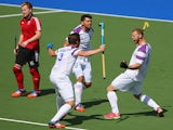 Daniel Coultas of Scotland celebrates after scoring a goal during the Men's preliminaries match between Scotland and Wales at Glasgow National Hockey Centre during day five of the Glasgow 2014 Commonwealth Games on July 28, 2014