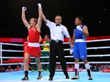 Shelley Watts of Australia celebrates winning the gold medal against Laishram Devi of India in the Women's Light (57 - 60kg) Final at SSE Hydro during day ten of the Glasgow 2014 Commonwealth Games on August 2, 2014