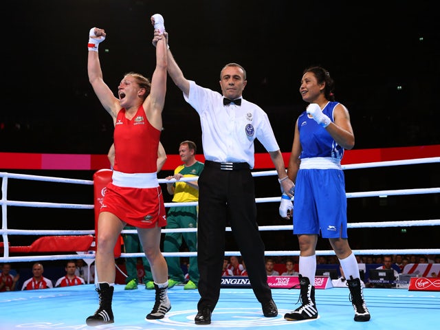 Shelley Watts of Australia celebrates winning the gold medal against Laishram Devi of India in the Women's Light (57 - 60kg) Final at SSE Hydro during day ten of the Glasgow 2014 Commonwealth Games on August 2, 2014