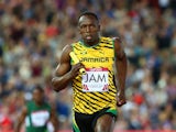 Usain Bolt competes in the Men's 4x100 metres relay heats at Hampden Park during day nine of the Glasgow 2014 Commonwealth Games on August 1, 2014