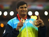 Gold medallist Vikas Shive Gowda of India poses on the podium during the medal ceremony for the Mens Discus Throw at Hampden Park during day eight of the Glasgow 2014 Commonwealth Games on July 31, 2014