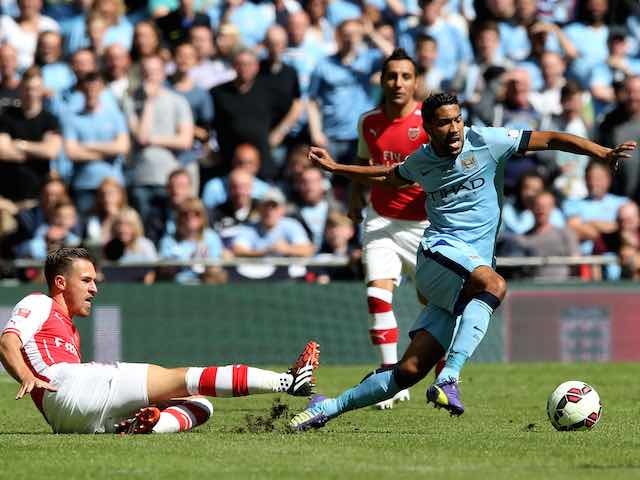 Arsenal's Aaron Ramsey tackles Man City's Gael Clichy during the Community Shield on August 10, 2014