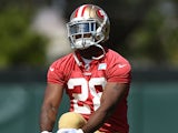 Carlos Hyde #28 of the San Francisco 49ers stretches during 49ers Rookie Minicamp on May 23, 2014