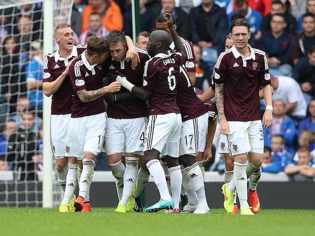 Danny Wilson is congratulated by Hearts teammates after he scores the opener against Rangers on August 10, 2014