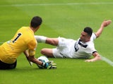 Newcastle's Emmanuel Riviere slides towards the Real Sociedad keeper on August 10, 2014