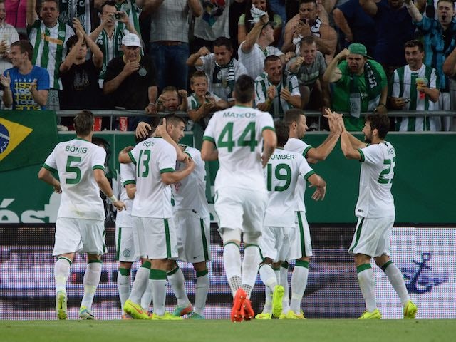 An assortment of Ferencvaros players celebrate scoring against Chelsea on August 10, 2014
