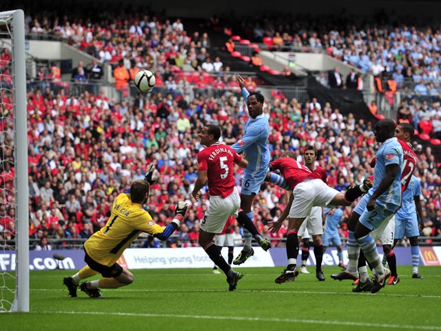 Manchester City's English defender Joleon Lescott scores a goal during the FA Community Shield football match between Manchester United and Manchester City at Wembley Stadium in London, on August 7, 2011