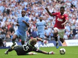 Manchester United's Portuguese midfielder Nani goes round Manchester City's English goalkeeper Joe Hart to score the third and winning goal during the FA Community Shield football match at Wembley Stadium in London, England on August 7, 2011