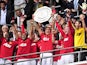 Manchester United's Serbian player Nemanja Vidic lifts the trophy after winning the match against Manchester City 3-2 during the FA Community Shield football match at Wembley Stadium in London, England on August 7, 2011