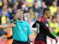 Norwich's Martin Olsson is shown the red card by Simon Hooper during the Canaries' Championship game with Wolves on August 10, 2014