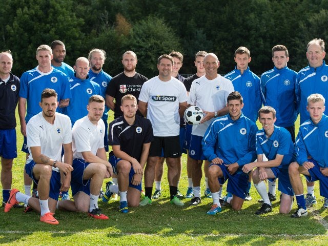 Michael Owen poses for a photograph with the Chester FC squad on August 4, 2014.