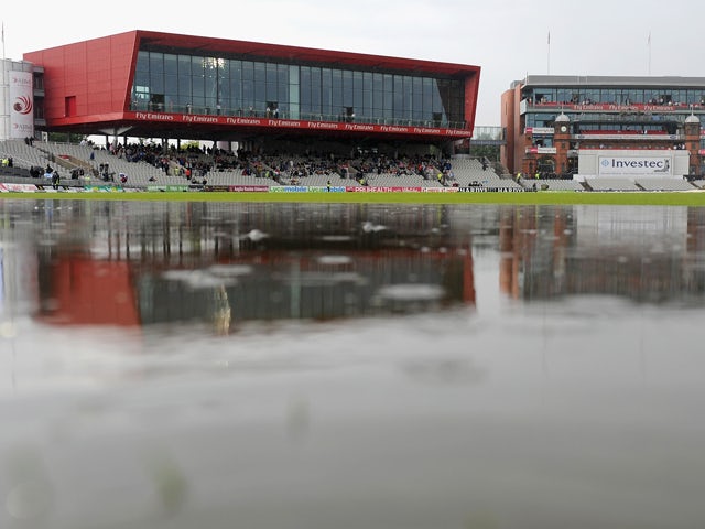 Puddles on the outfield as rain delays play during day two of 4th Investec Test match between England and India at Old Trafford on August 8, 2014