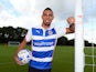 Anton Ferdinand poses in a Reading shirt after signing for the Royals on August 11, 2014