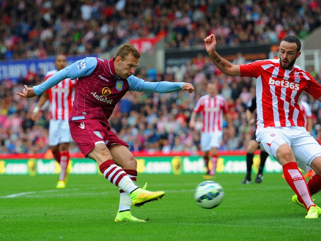 Andreas Weimann of Aston Villa scores the opening goal during the Barclays Premier League match between Stoke City and Aston Villa at Britannia Stadium on August 16, 2014
