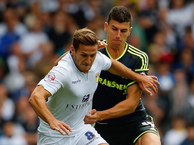 Leeds's Billy Sharp and Middlesbrough's Daniel Ayala grapple for the ball on August 16, 2014