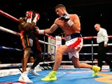 Callum Smith of England in action with Vladine Biosse of the USA during their WBC International Super Middleweight Championship fight at the Liverpool Echo Arena on July 12, 2014
