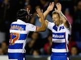 Craig Tanner of Reading is congratulated by team mate Ryan Edwards after scoring his team's third goal of the game during the Capital One Cup First Round match against Newport on August 12, 2014