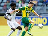 Swansea City's Dutch player Wilfried Bony vies with Danny Holla from ADO Den Haag during their friendly football match at the Kyocera stadion in The Hague, on July 13, 2013