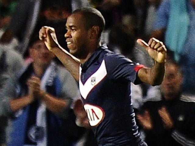 Bordeaux's Uruguayan forward Diego Rolan (C) celebrates with teammates after scoring a goal during the French L1 football match Bordeaux (FCGB) vs Moncao (ASMFC) on August 17, 2014 
