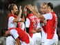 Monaco's forward Dimitar Berbatov (R) celebrates with teammates after scoring a goal during the French L1 football match between Bordeaux (FCGB) and Monaco (ASM) on August 17, 2014